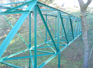 small blue trestle bridge