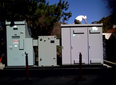 Man workng on High Voltage Electrical Boxes